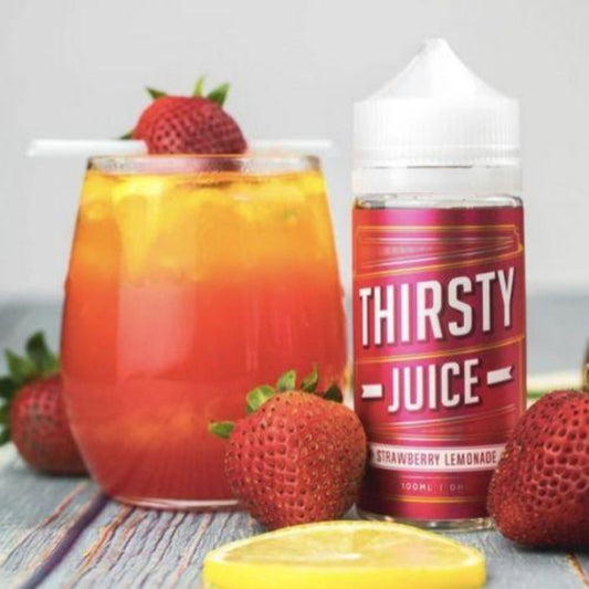Thirsty Juice Co | Strawberry Lemonade | 100ml bottle with 4 strawberries and 1 sliced lemon and a glass of strawberry juice
